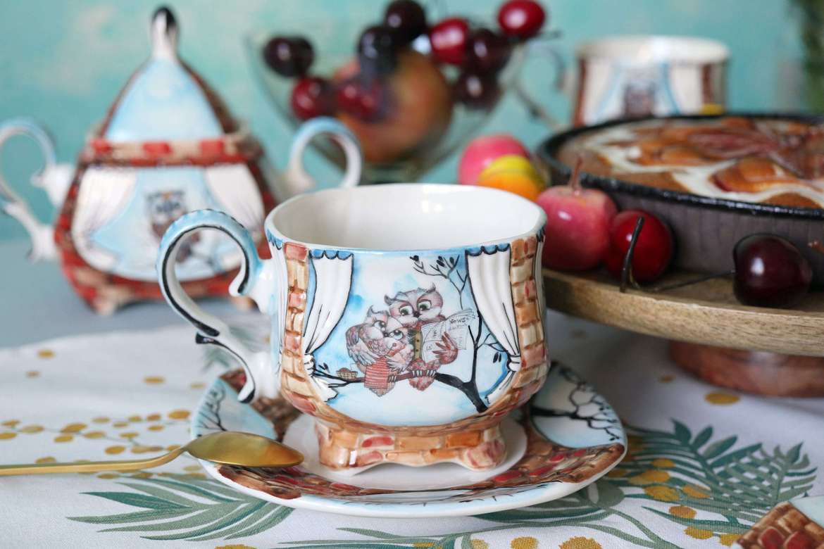Handmade porcelain tea cup and saucer "Owls Grandmother and Grandfather"