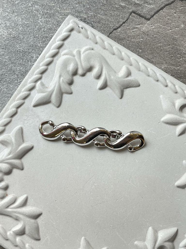 Винтажная брошь «Звенья бесконечности»