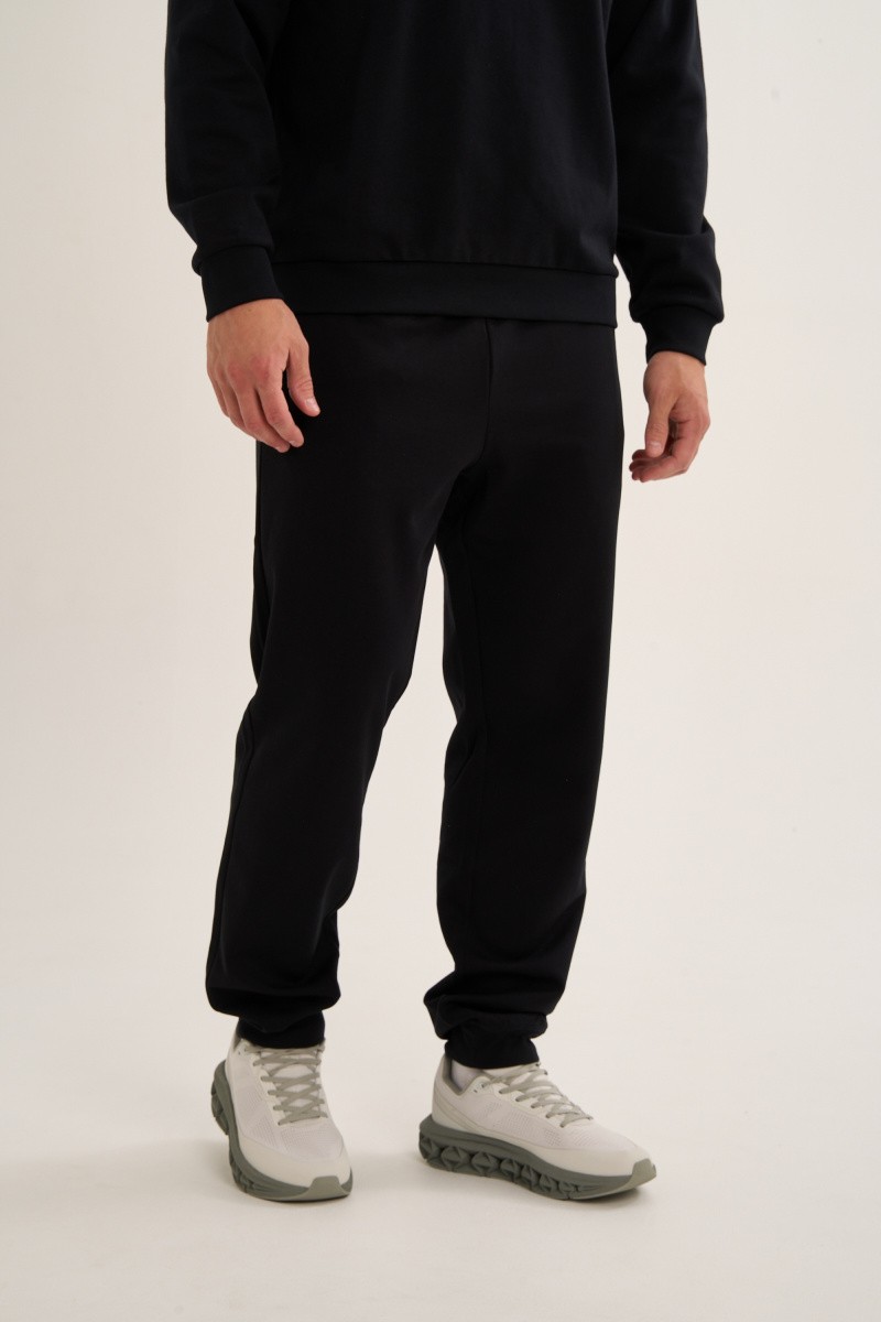 БРЮКИ ТРИКОТАЖНЫЕ УДЛИНЕННЫЕ ANTA TRN-ESSENTIAL KNIT TRACK PANTS