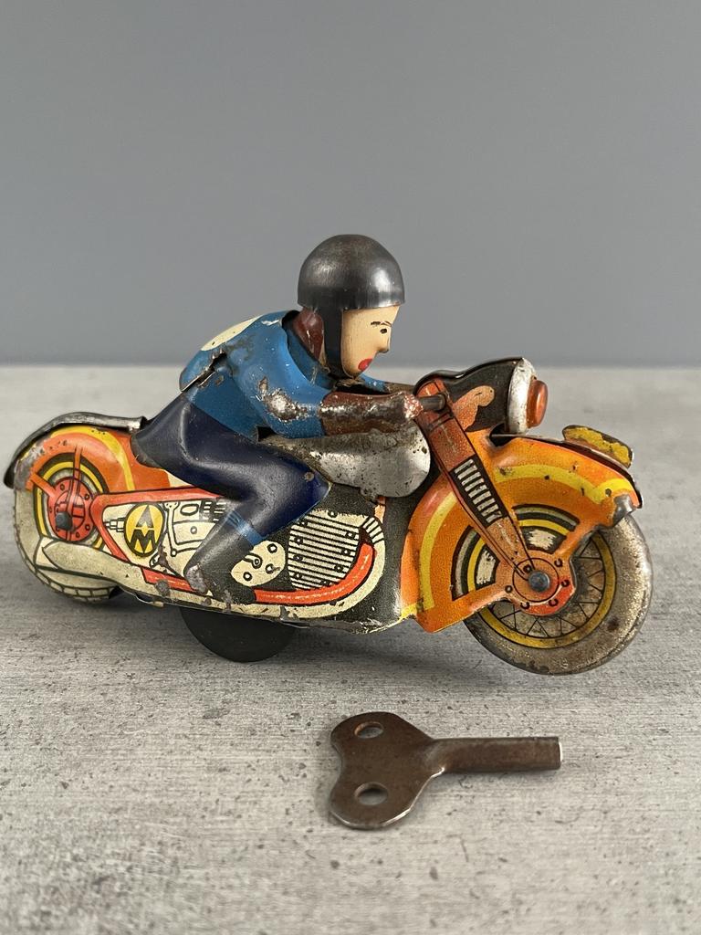 Заводная игрушка «Мотогонщик» СССР