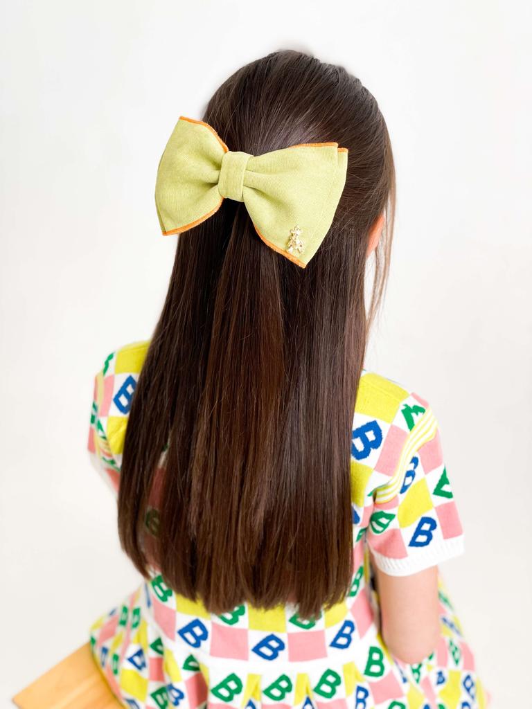 Бант на заколке «Adelina» цвет фисташковый/оранжевый кант