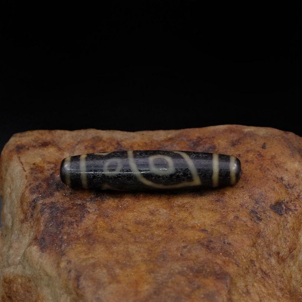 Бусина Дзи 5 глаз и глаза феникса