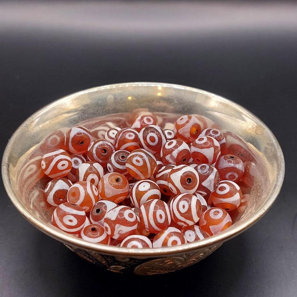 Бусина дзи из сердолика