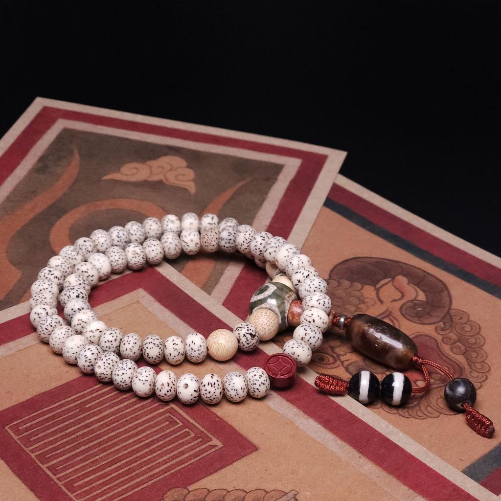 Чётки 66 бусин из корня лотоса с бусинами дзи