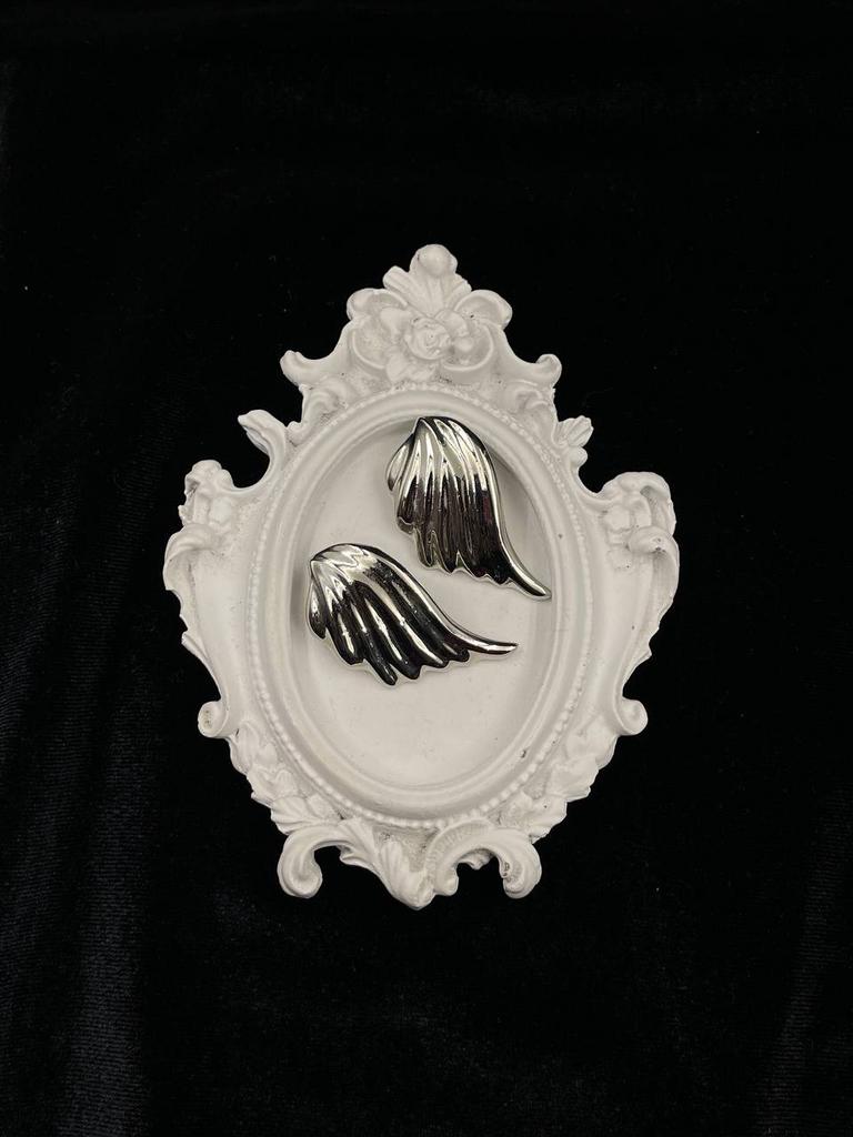 Винтажные клипсы «Взмах крыла» в серебряном оттенке