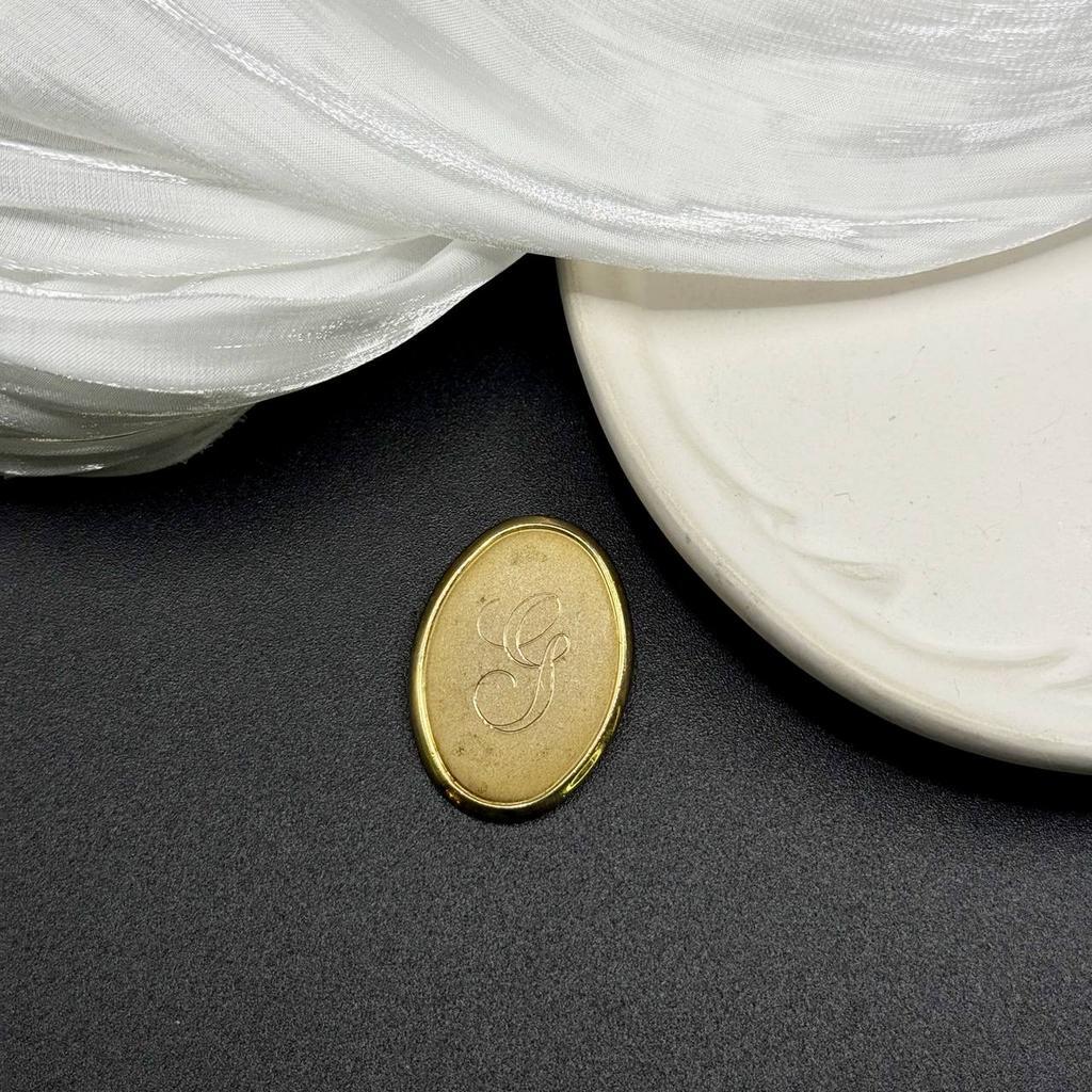 Винтажная брошь «G» 70е