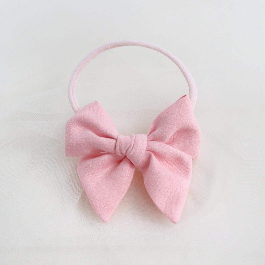 Повязка на голову "Замшевый бантик" цвет щербет