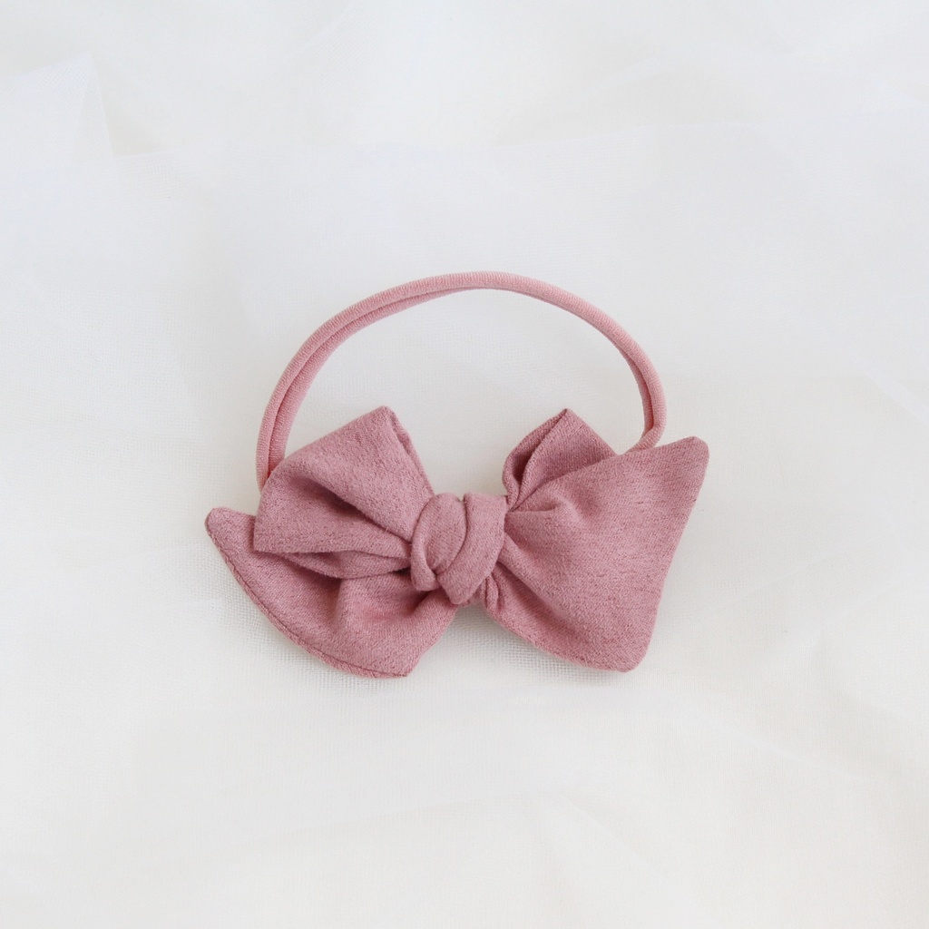 Повязка на голову "Замшевый бантик" грязно-розовый