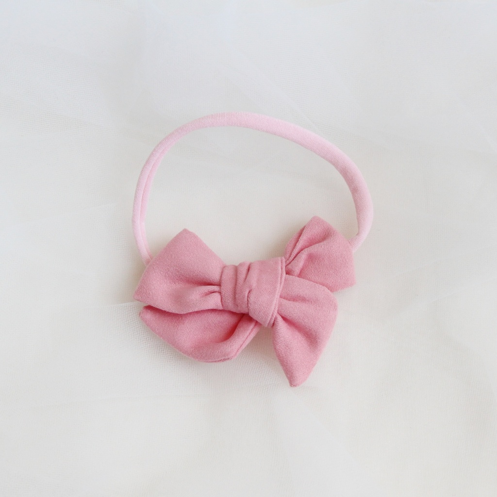 Повязка на голову "Замшевый бантик" розовый