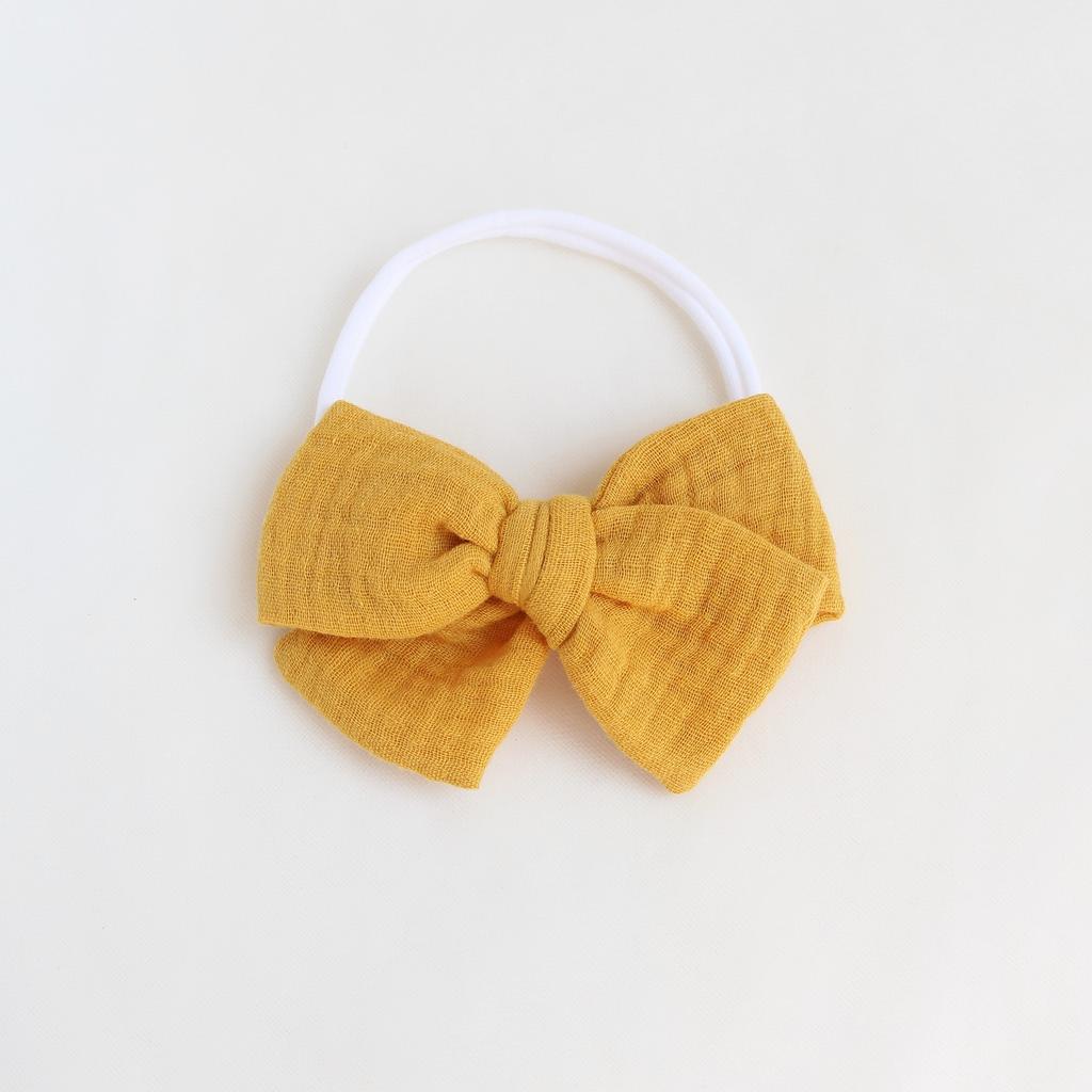 Повязка на голову "Муслиновый бант" горчичный