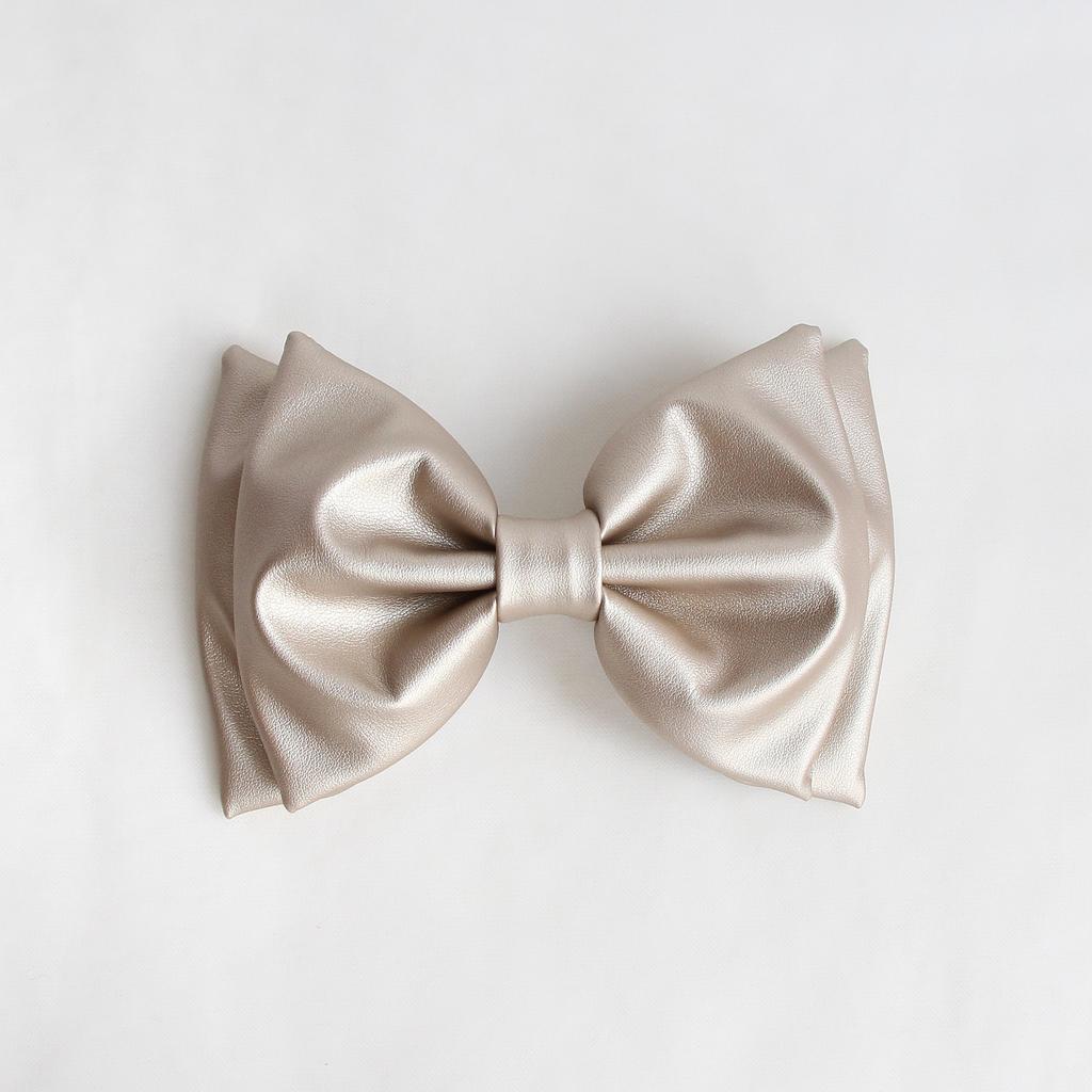 Заколка-автомат "Бант из экокожи" золотой