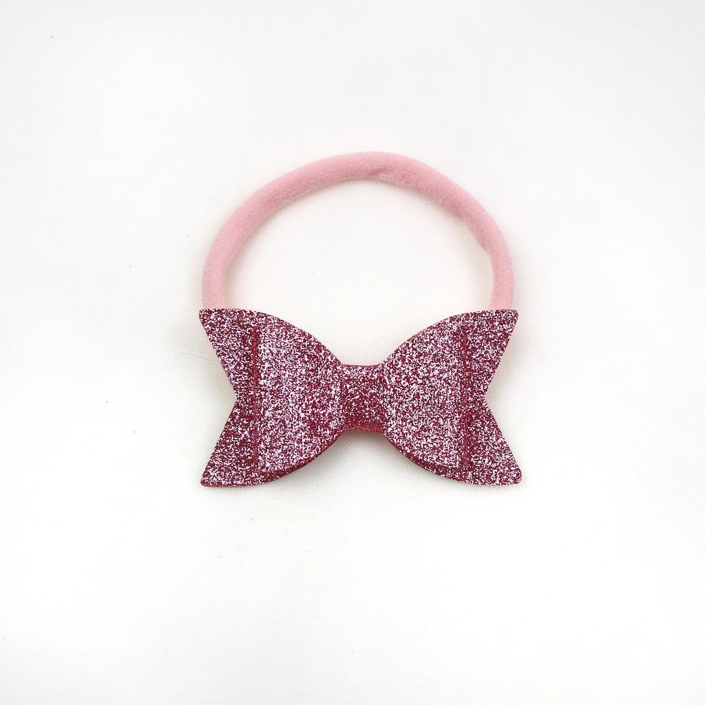 Повязка на голову "Блестящий бант" розовый