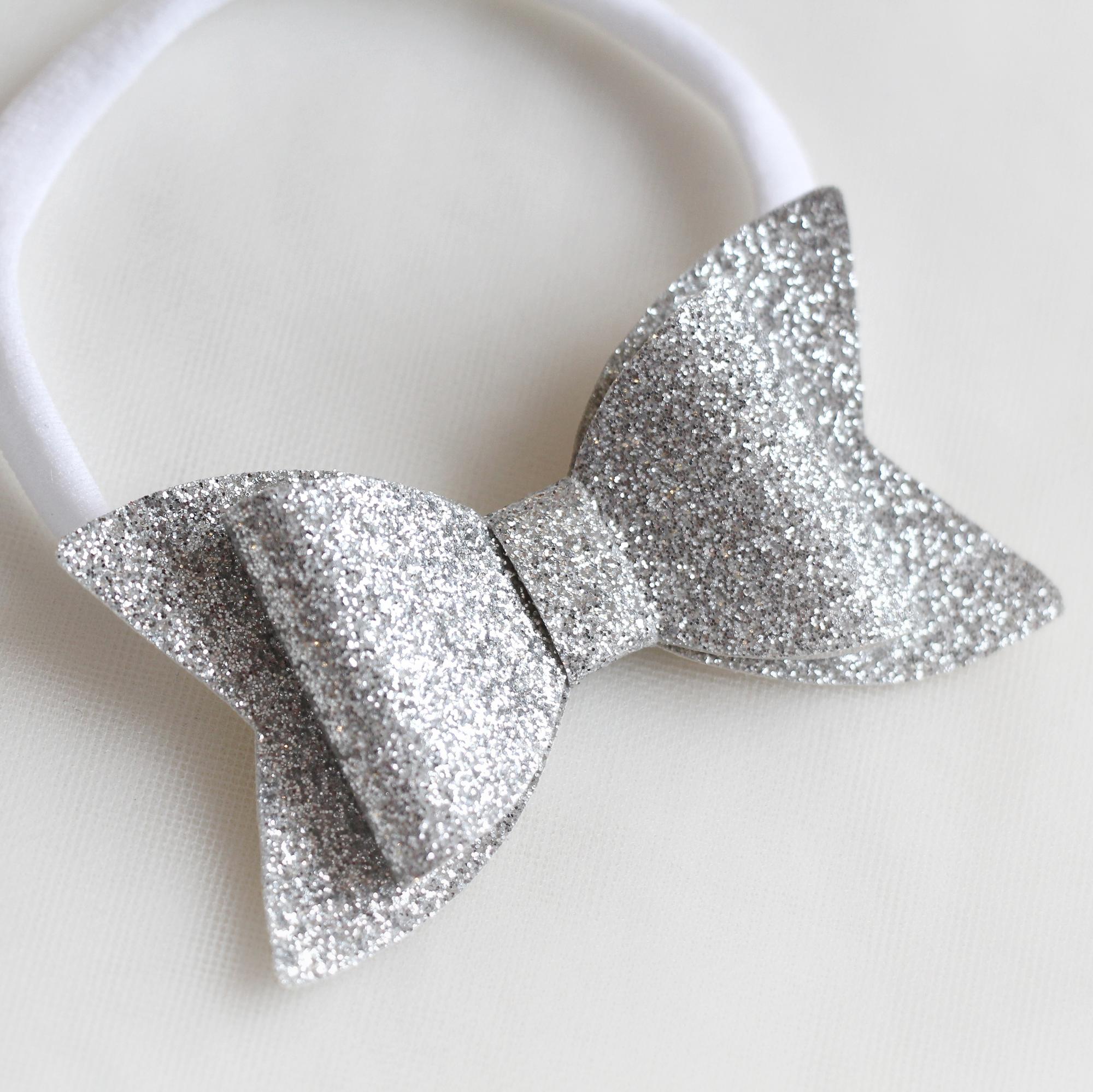 Повязка на голову "Блестящий бант" серебряный