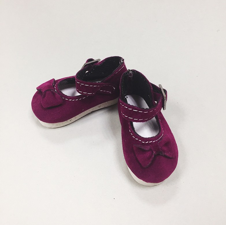 Purple shoes with a bow