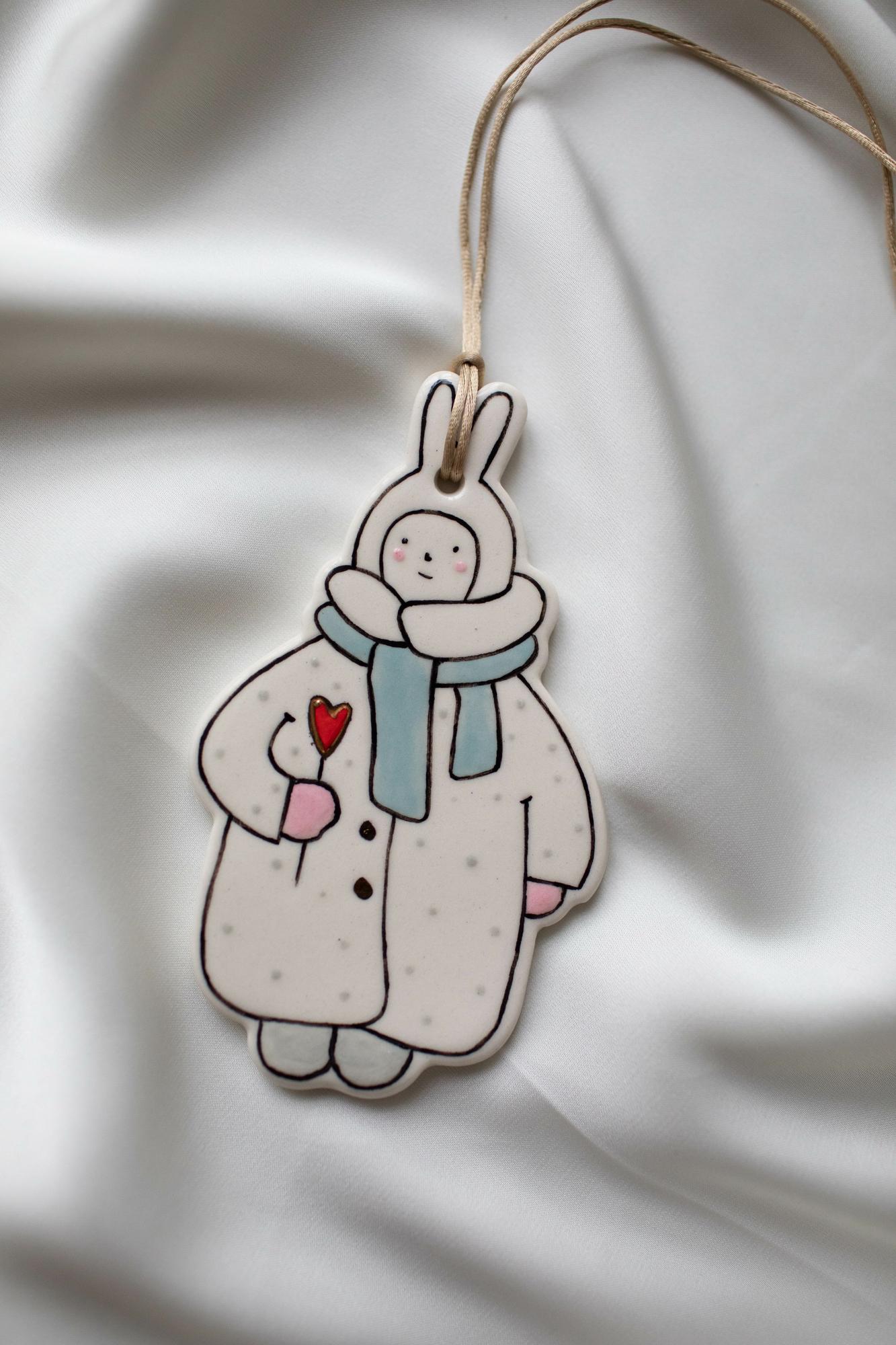 Мальчик-зайчик с голубым шарфом