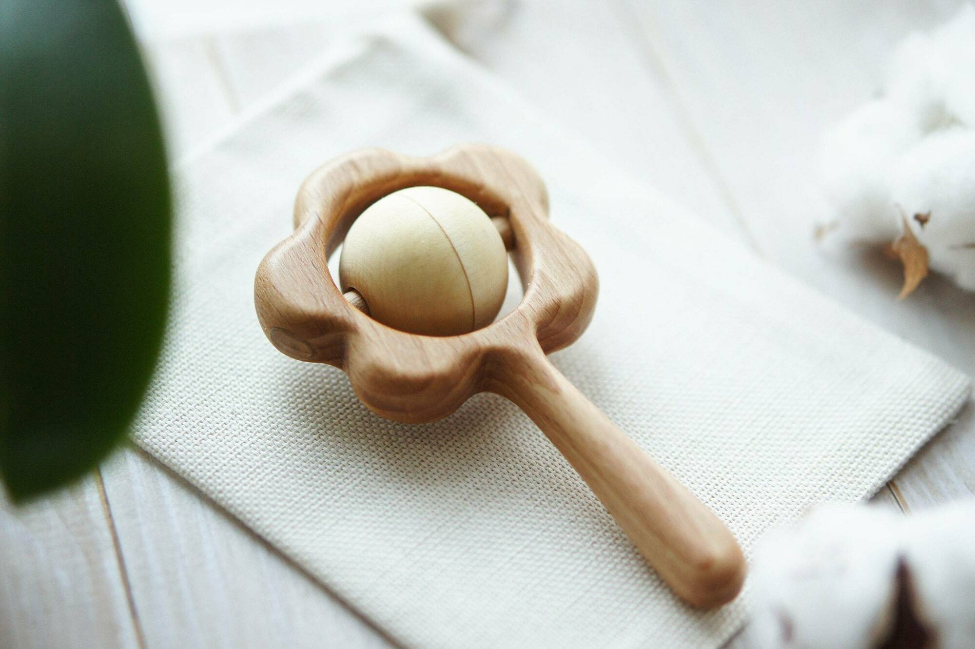 Traditional wooden flower rattle