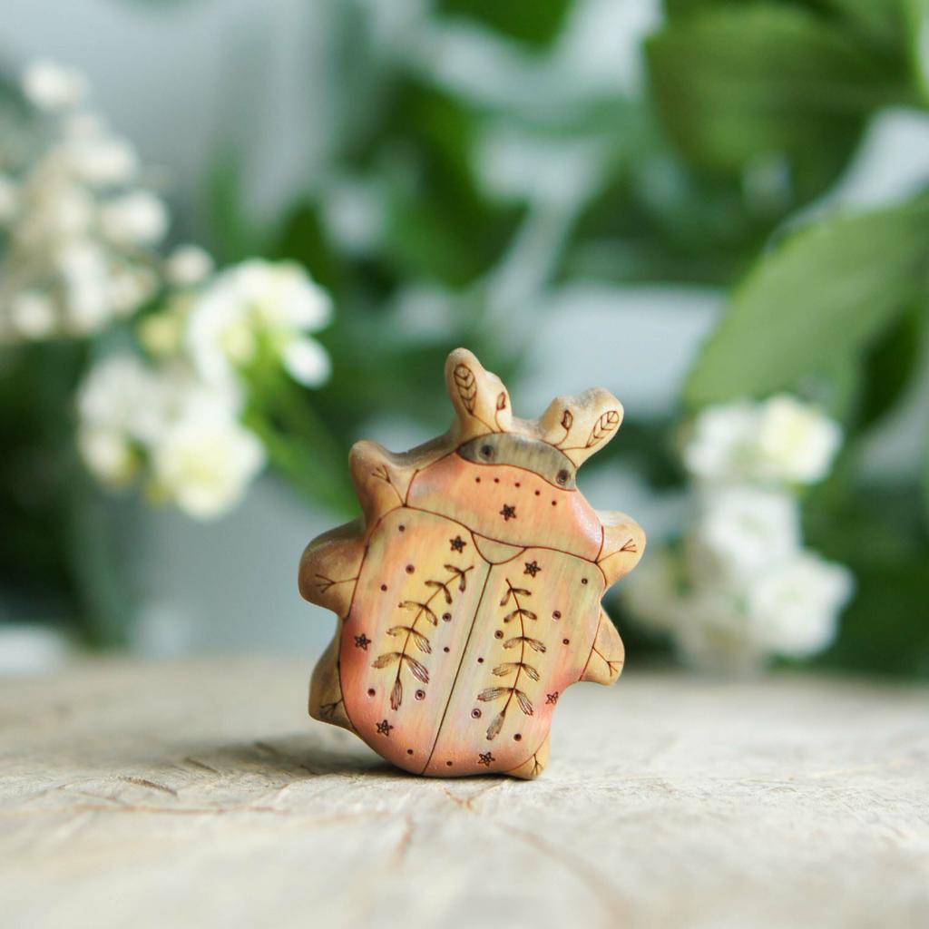 Bronze beetle wooden toy