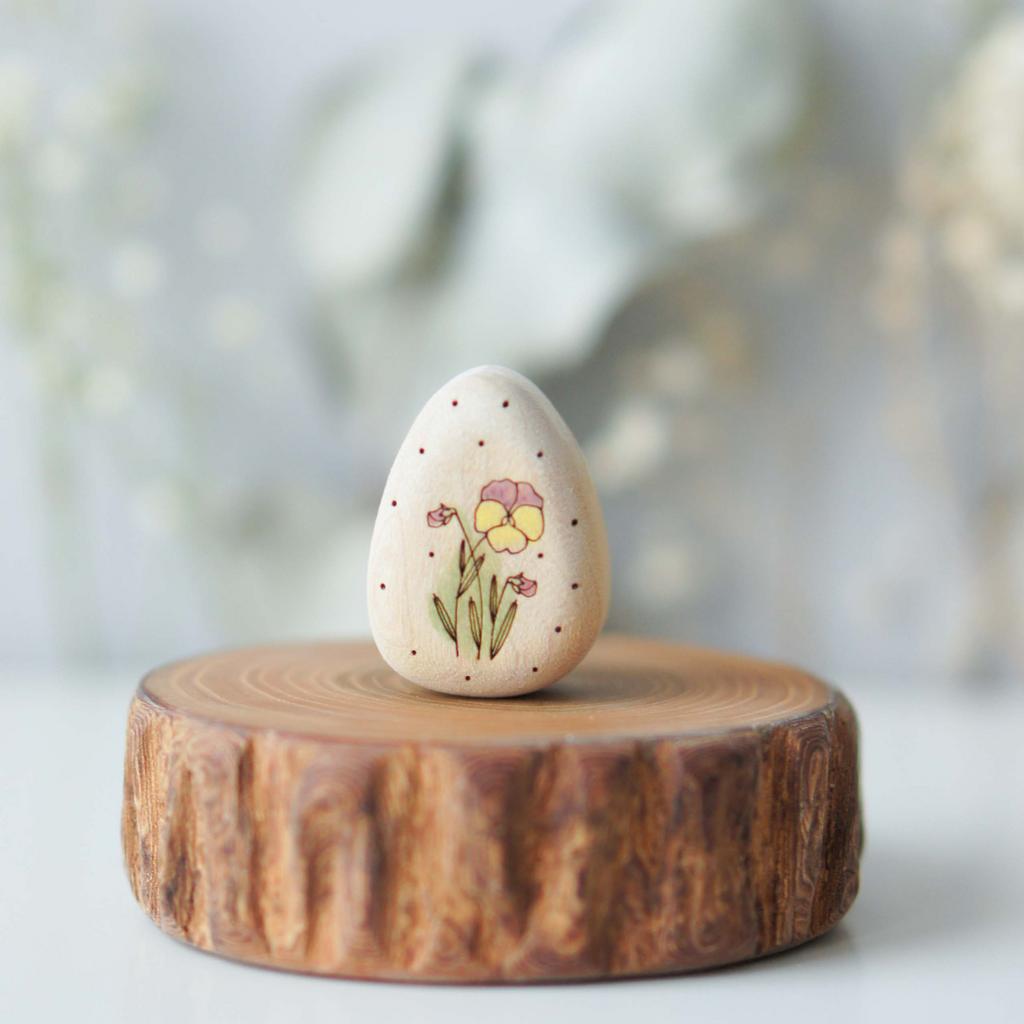 White egg with pansy pink