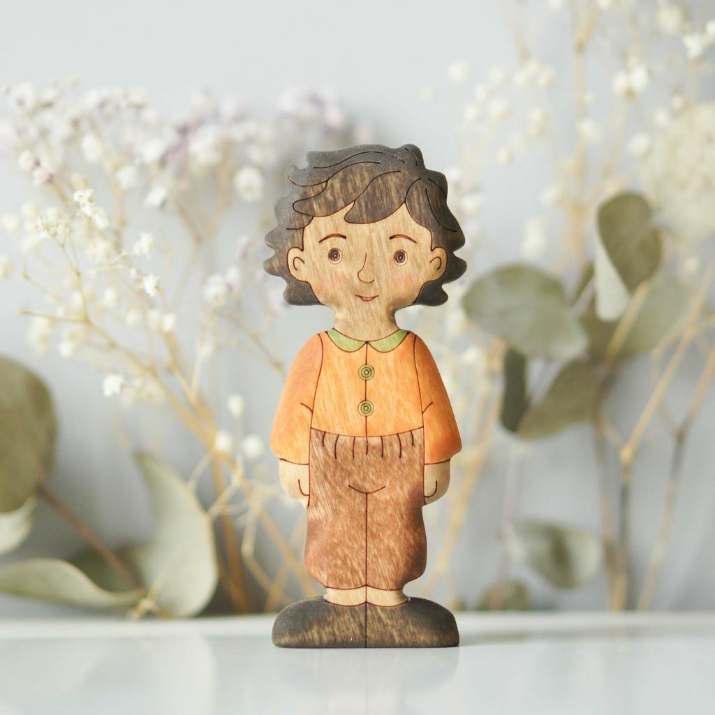 Boy (in orange) brunette (dark skin)