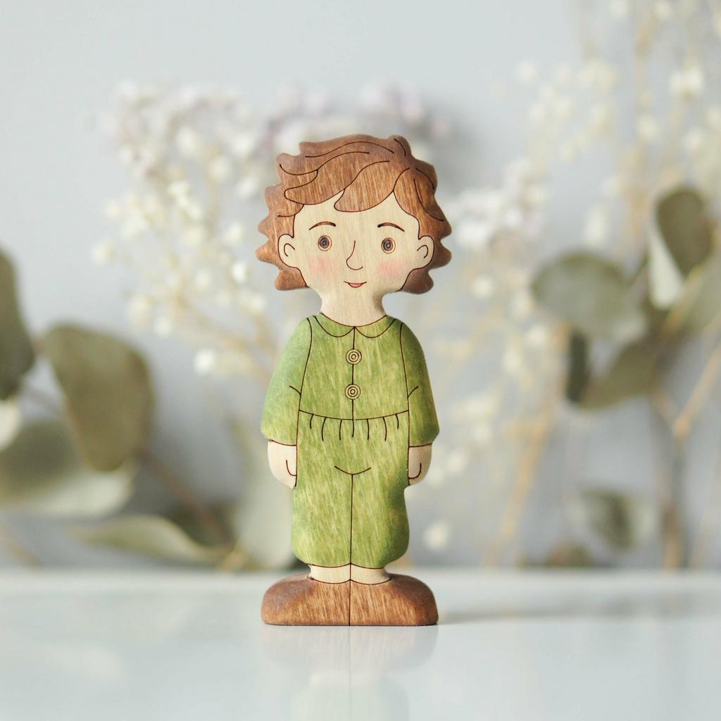 Boy (in green) brunette (light skin)