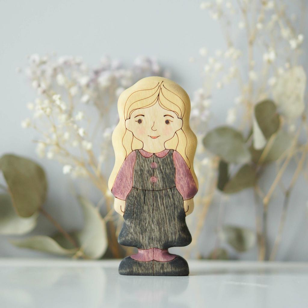 Girl (in purple dress) blonde (light skin)