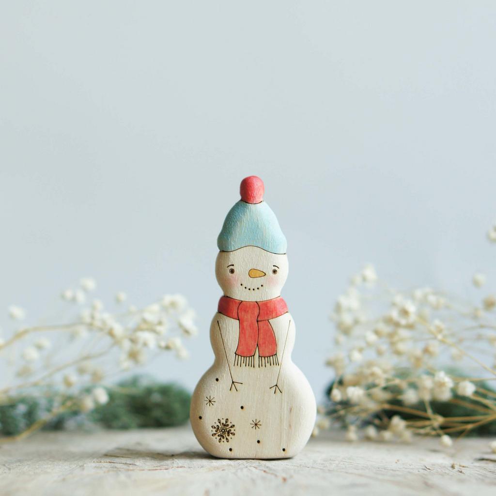 Snowman (painted blue hat) with a red scarf