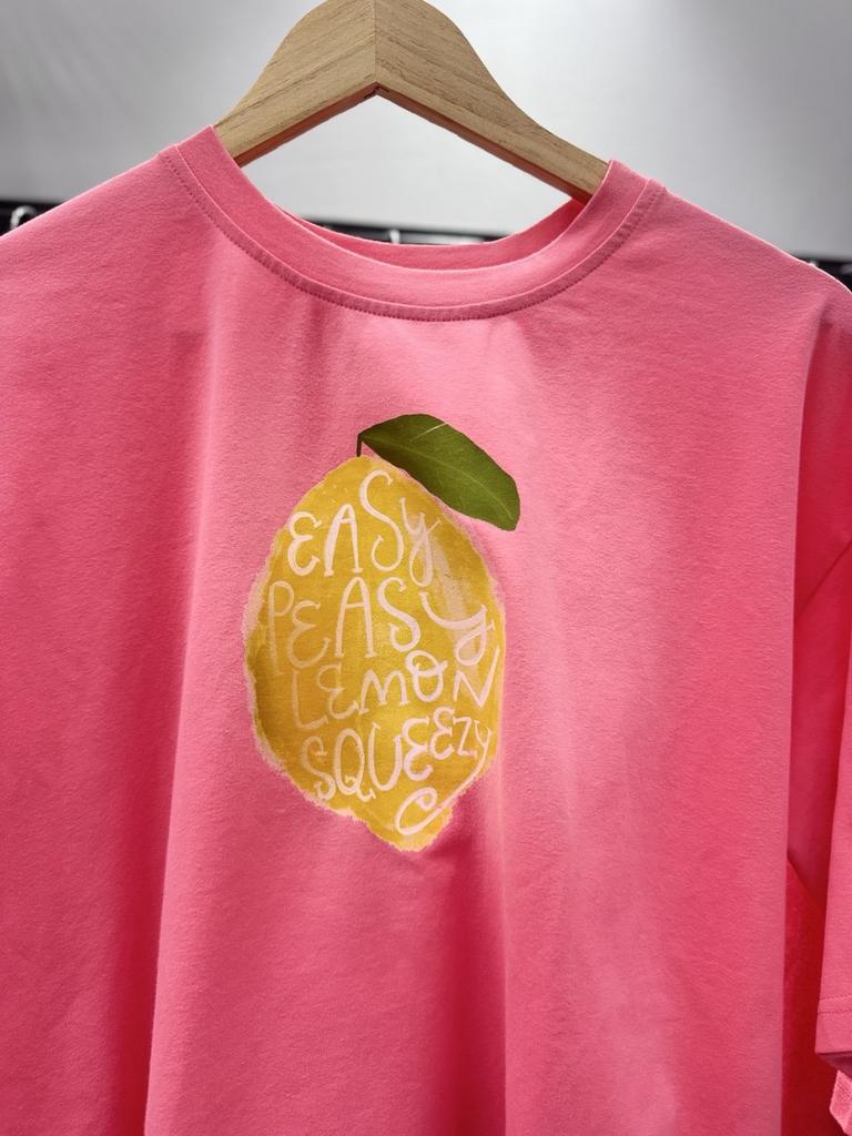 Лимон  на розовом