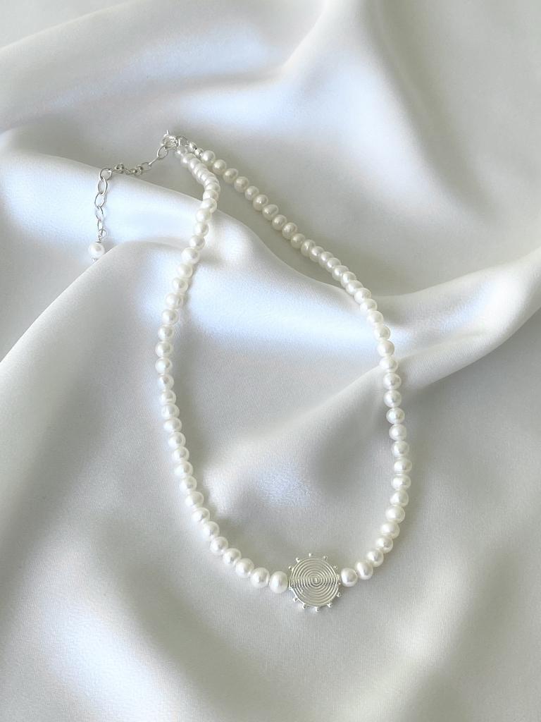 Necklace with pearls and sun
