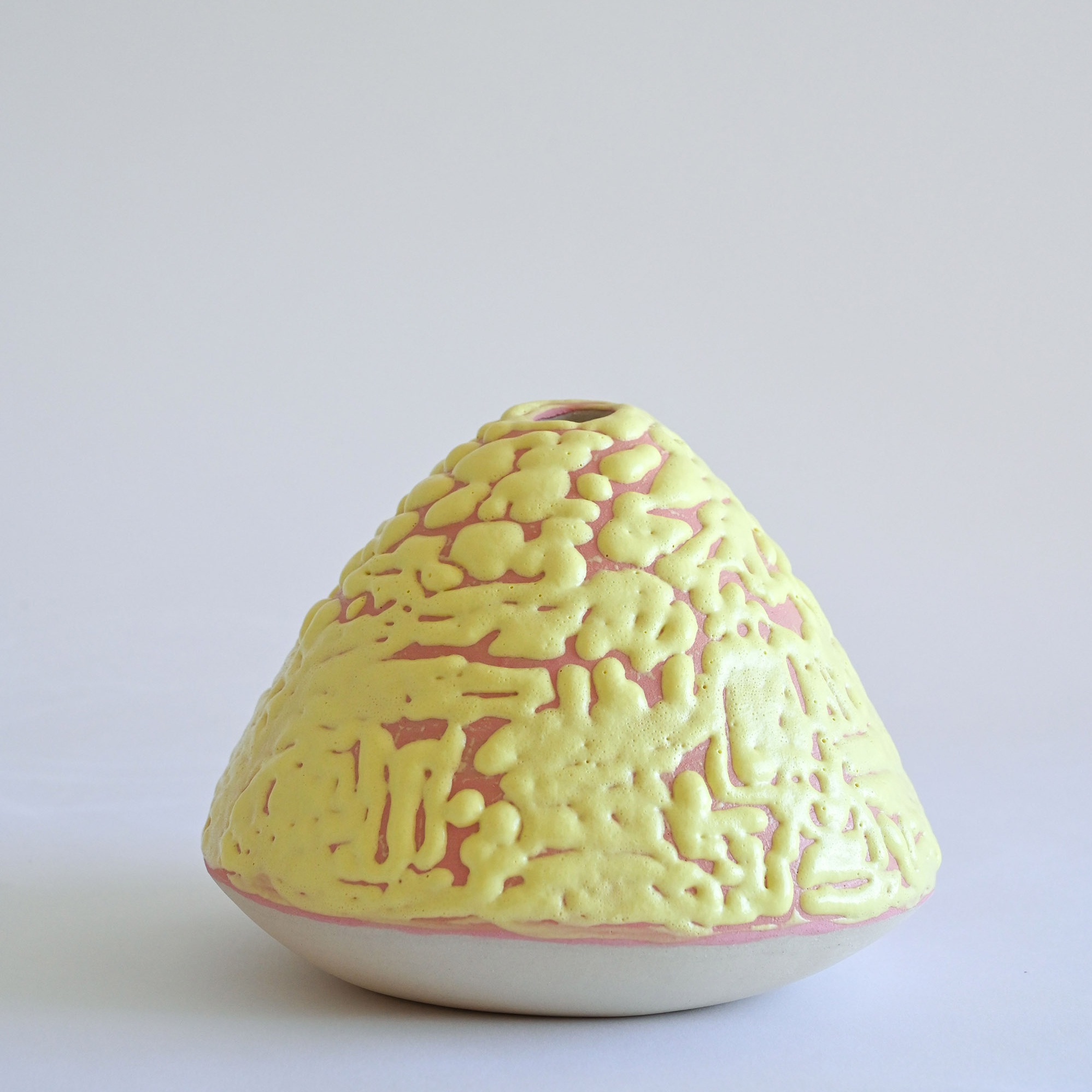 Minimalist modern design pink vase with yellow crawl glaze