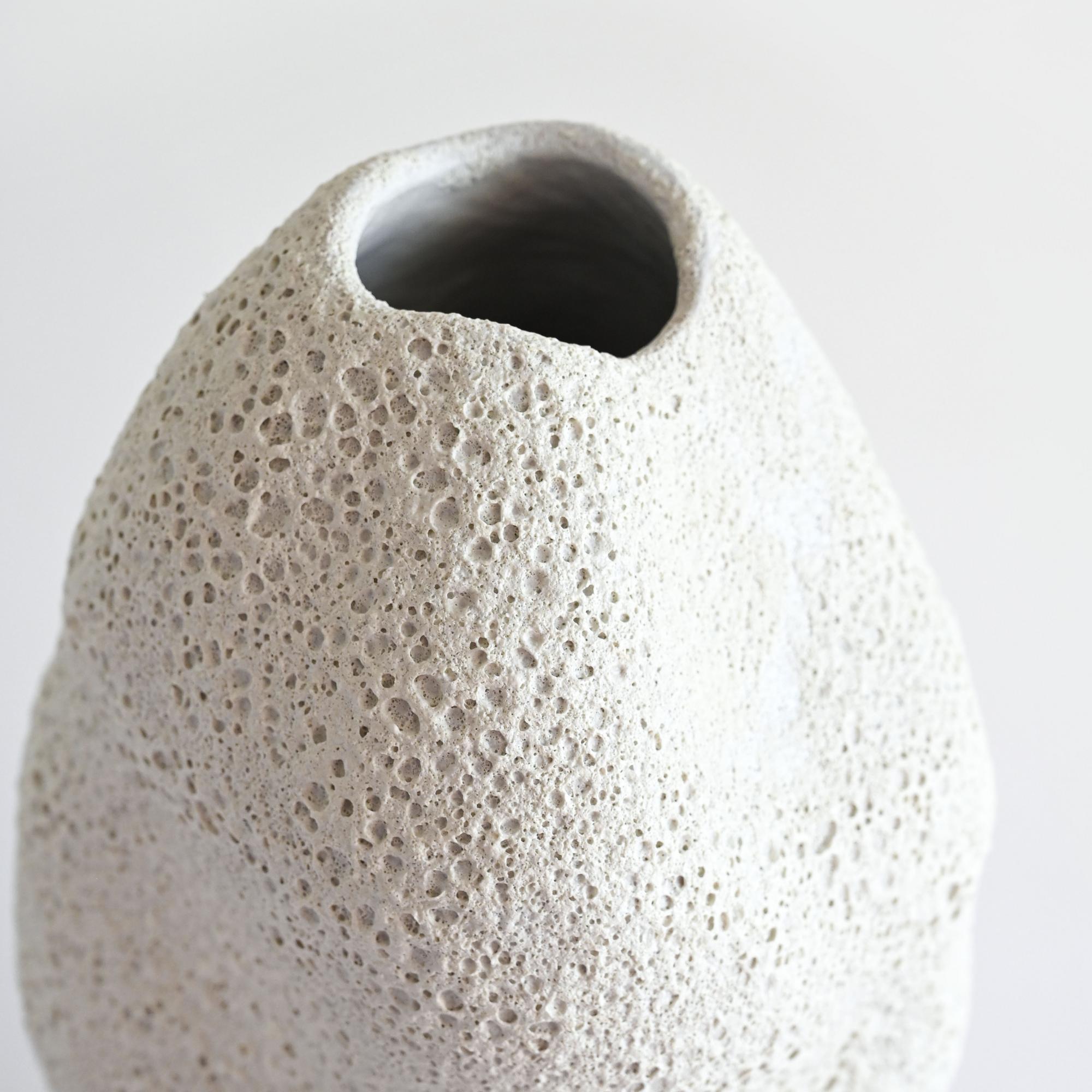 White  handmade ceramic vase rustic/boho style with a foamy, lava-like surface details