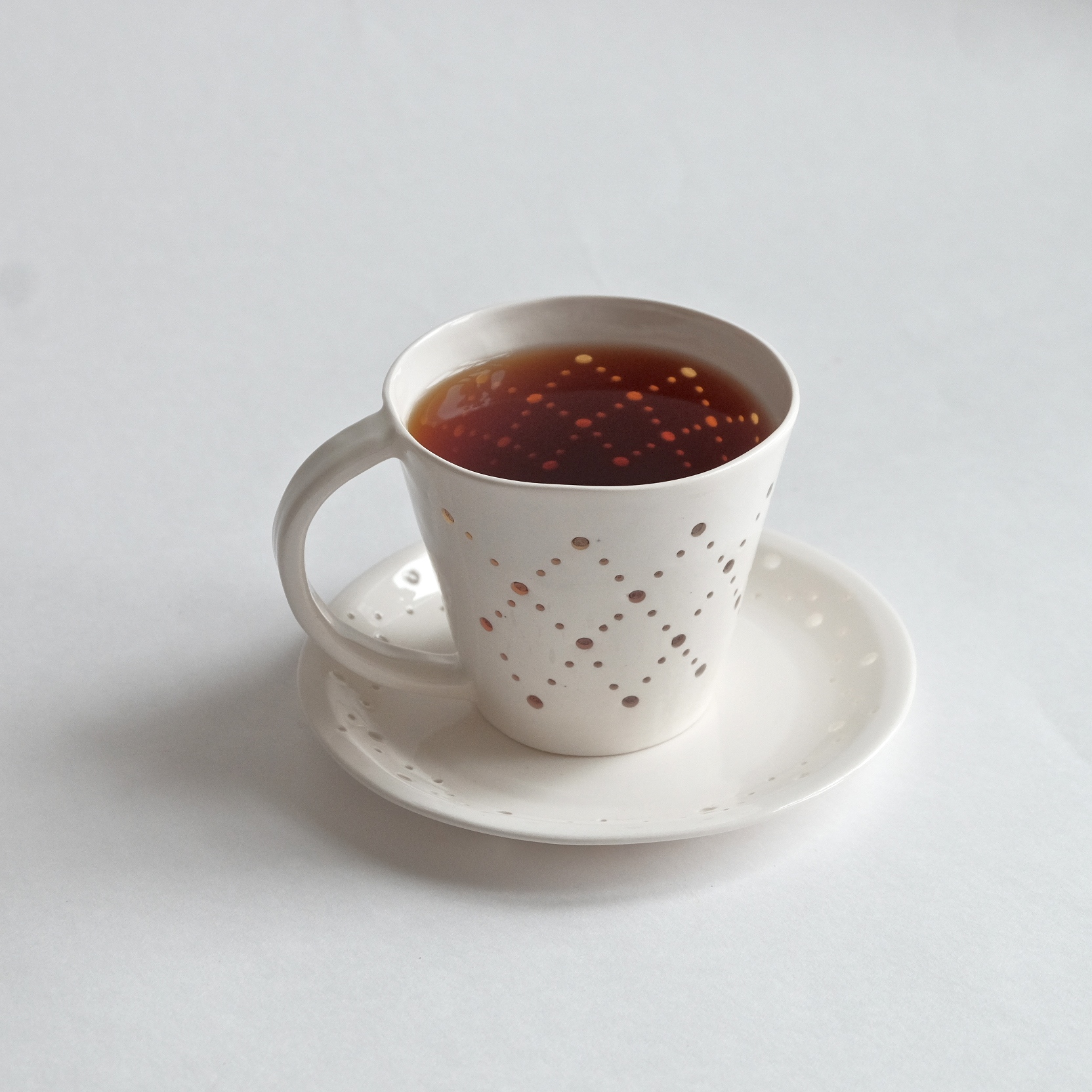 Чайная пара из фарфора с прорезным узором Ромбы (кружка с блюдцем)