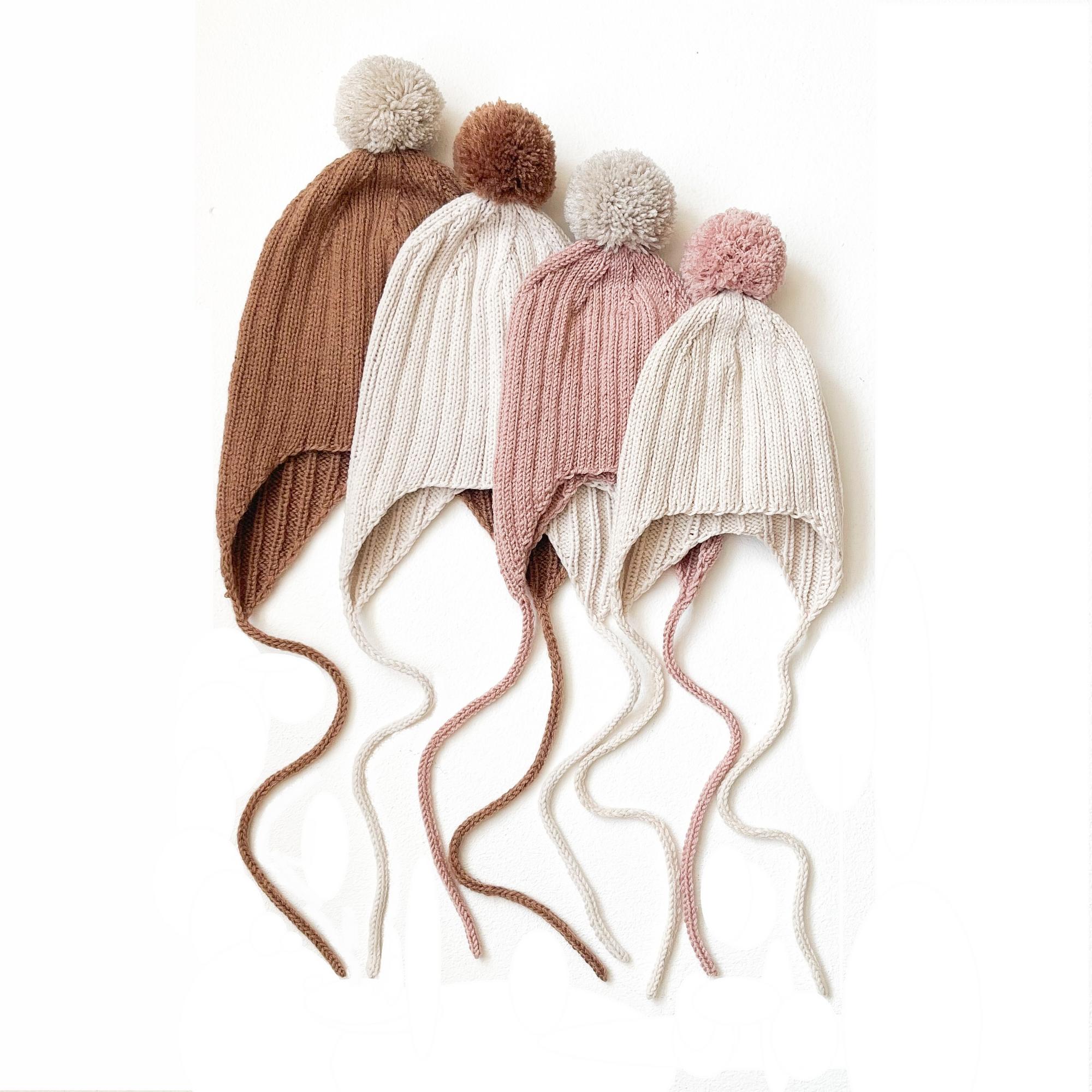 Описание "Шапочка в рубчик с помпоном"