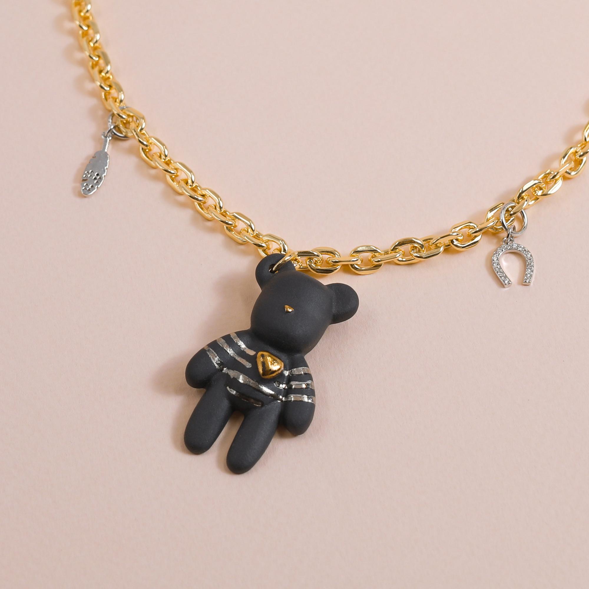Колье Мишка Готье черный с платиновыми полосками и талисманами