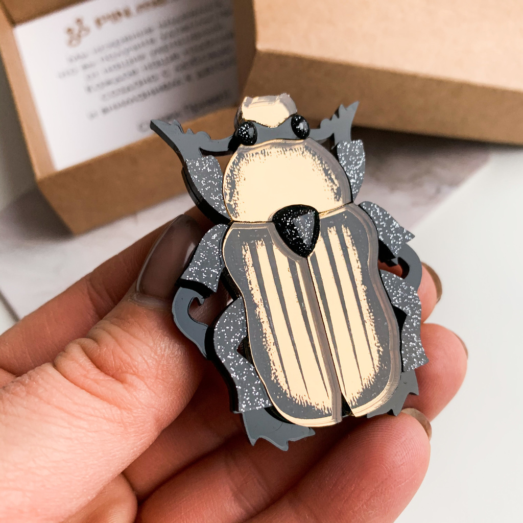 Жук темное золото