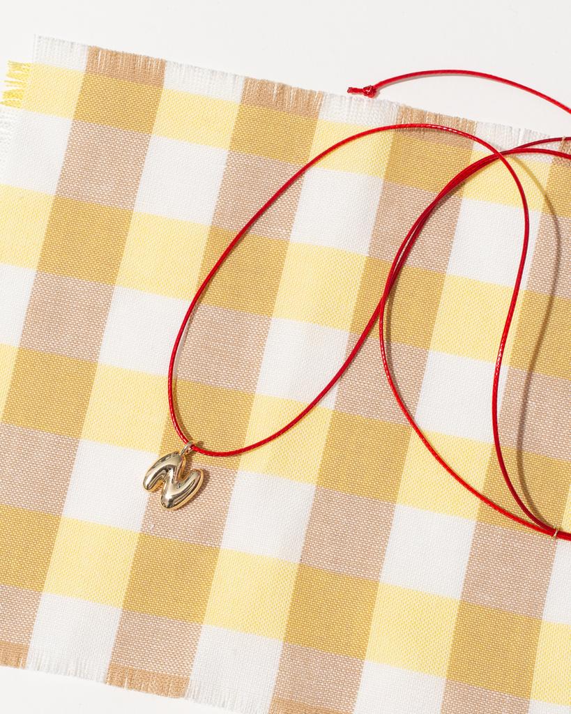 Шнурок с буквой