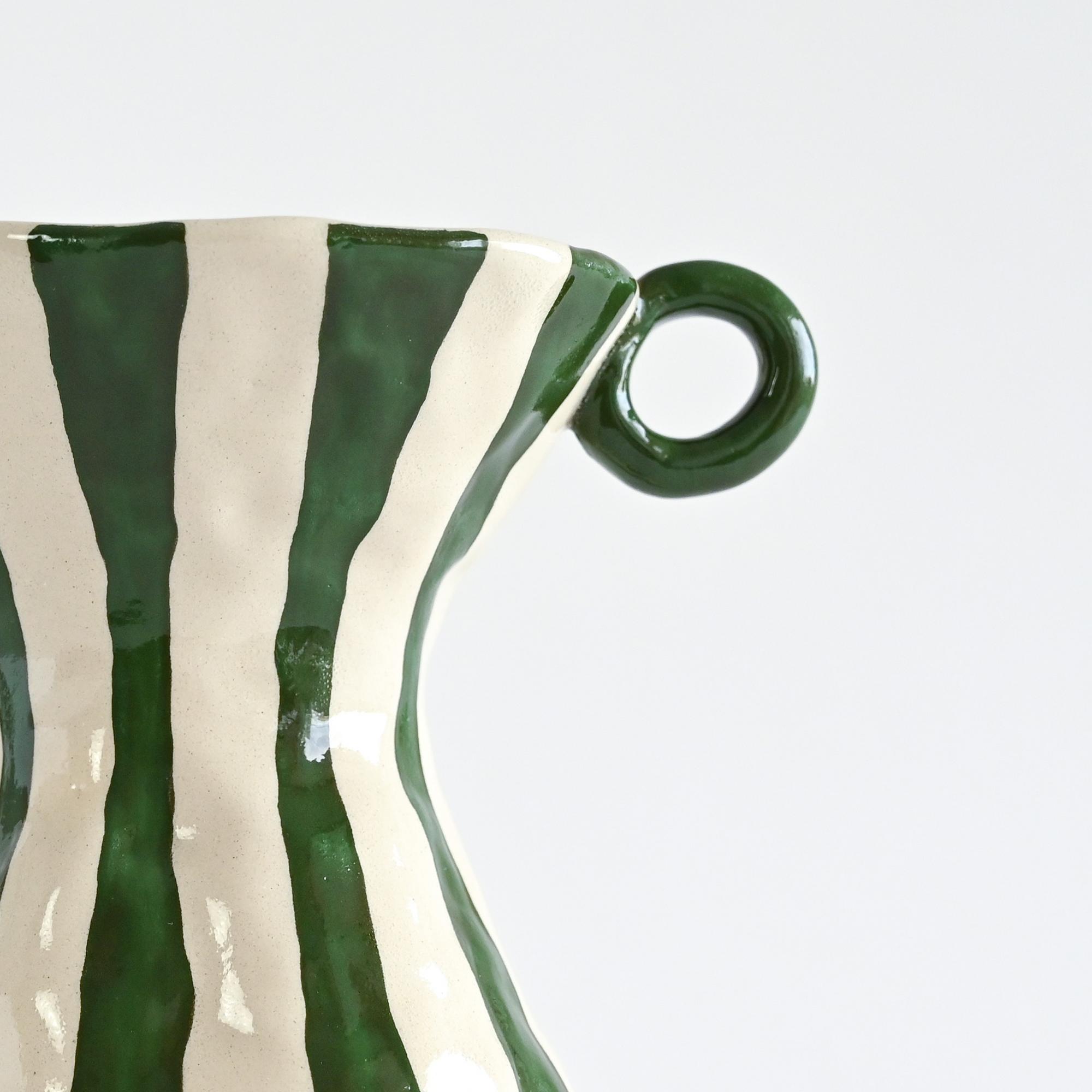 Handmade ceramic vase with white and green stripes details