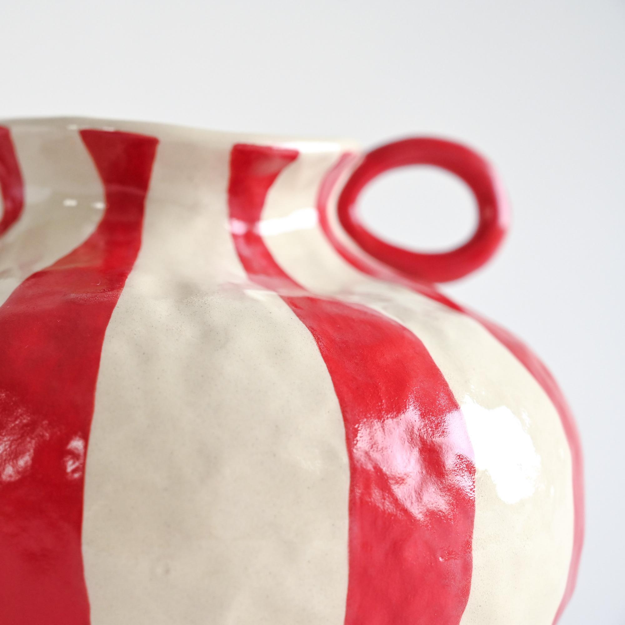Handmade ceramic vase with white and red stripes details