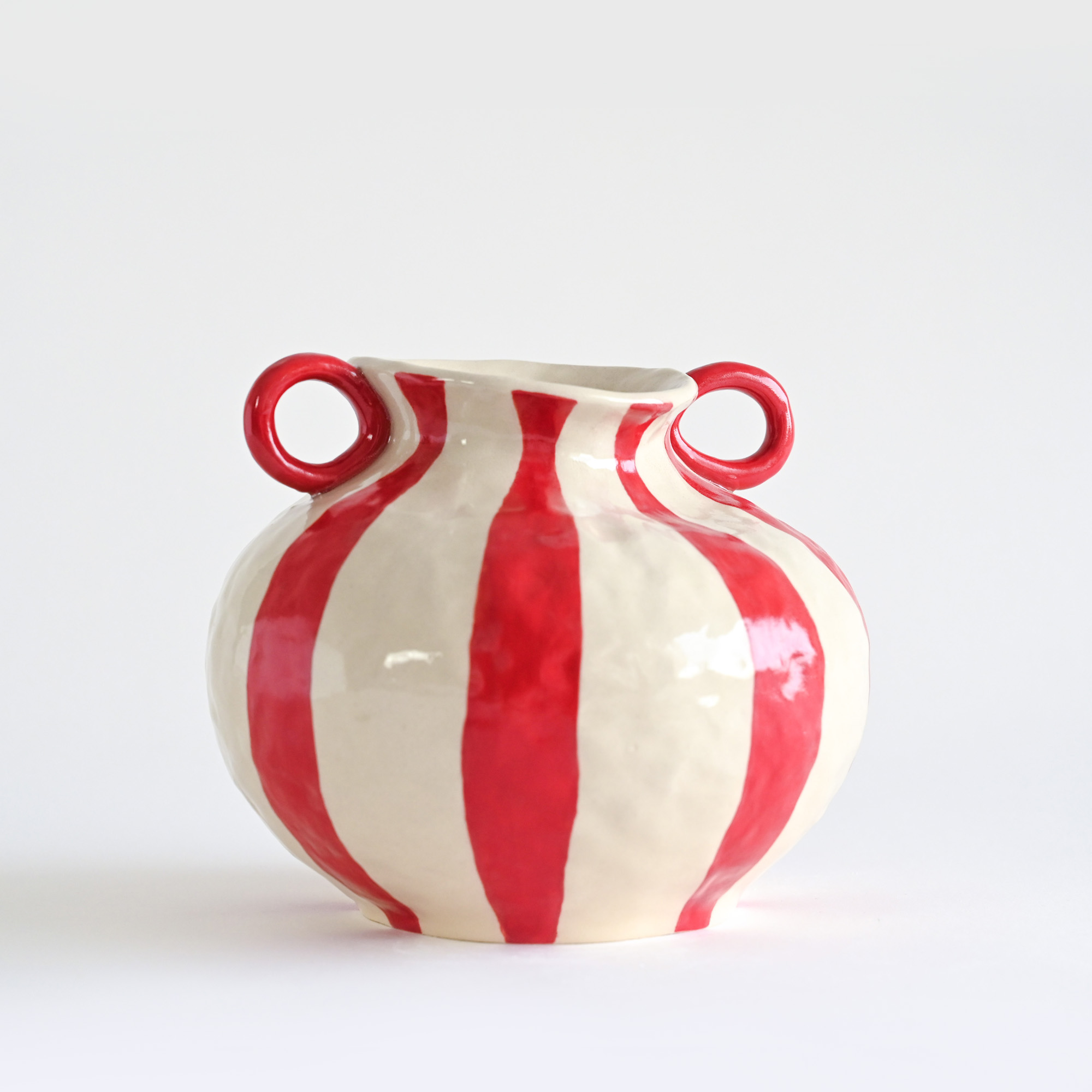 Handmade ceramic vase with white and red stripes