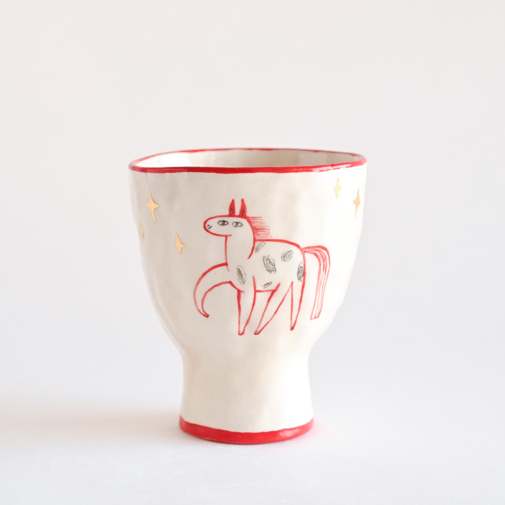 Handmade ceramic cup with a hand-painted horse