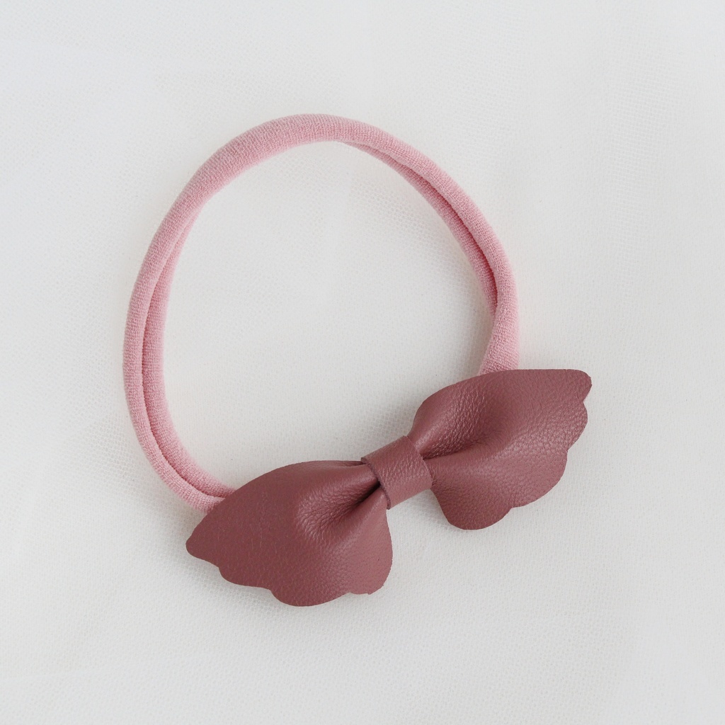 Повязка на голову "Кожаный бантик-крылья" цвет грязно-розовый
