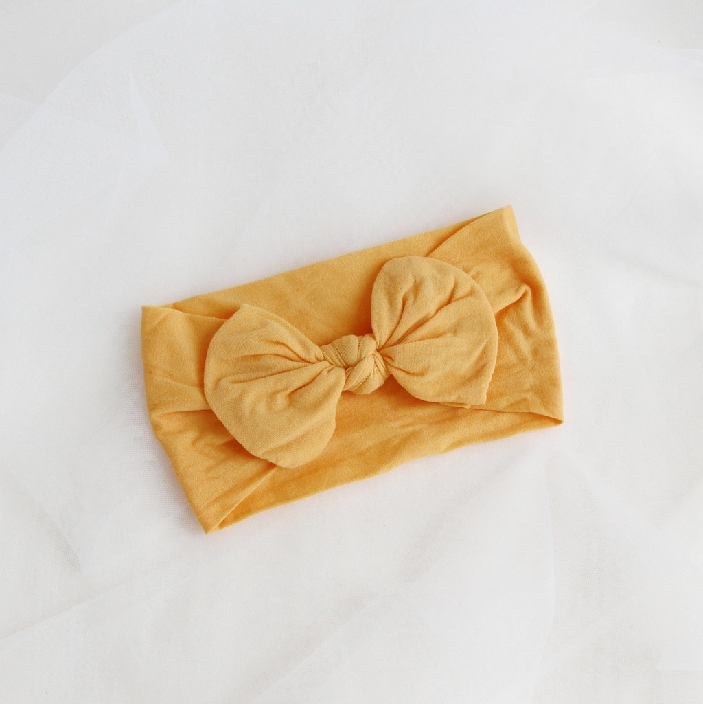 Повязка на голову "Широкий бант" желтый