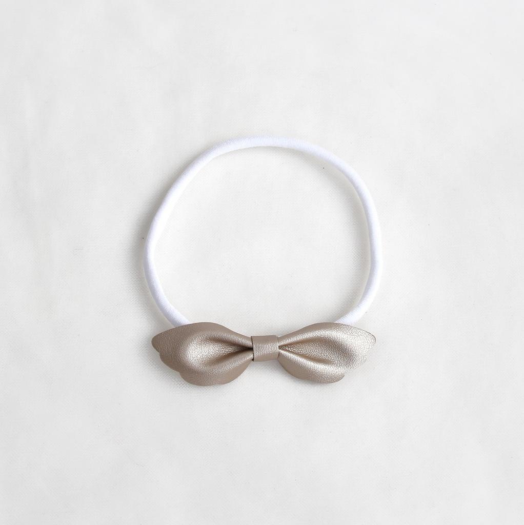 Повязка на голову "Бантик-крылья" золото