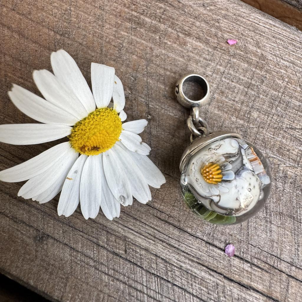 White flower on grey aquarium dangle