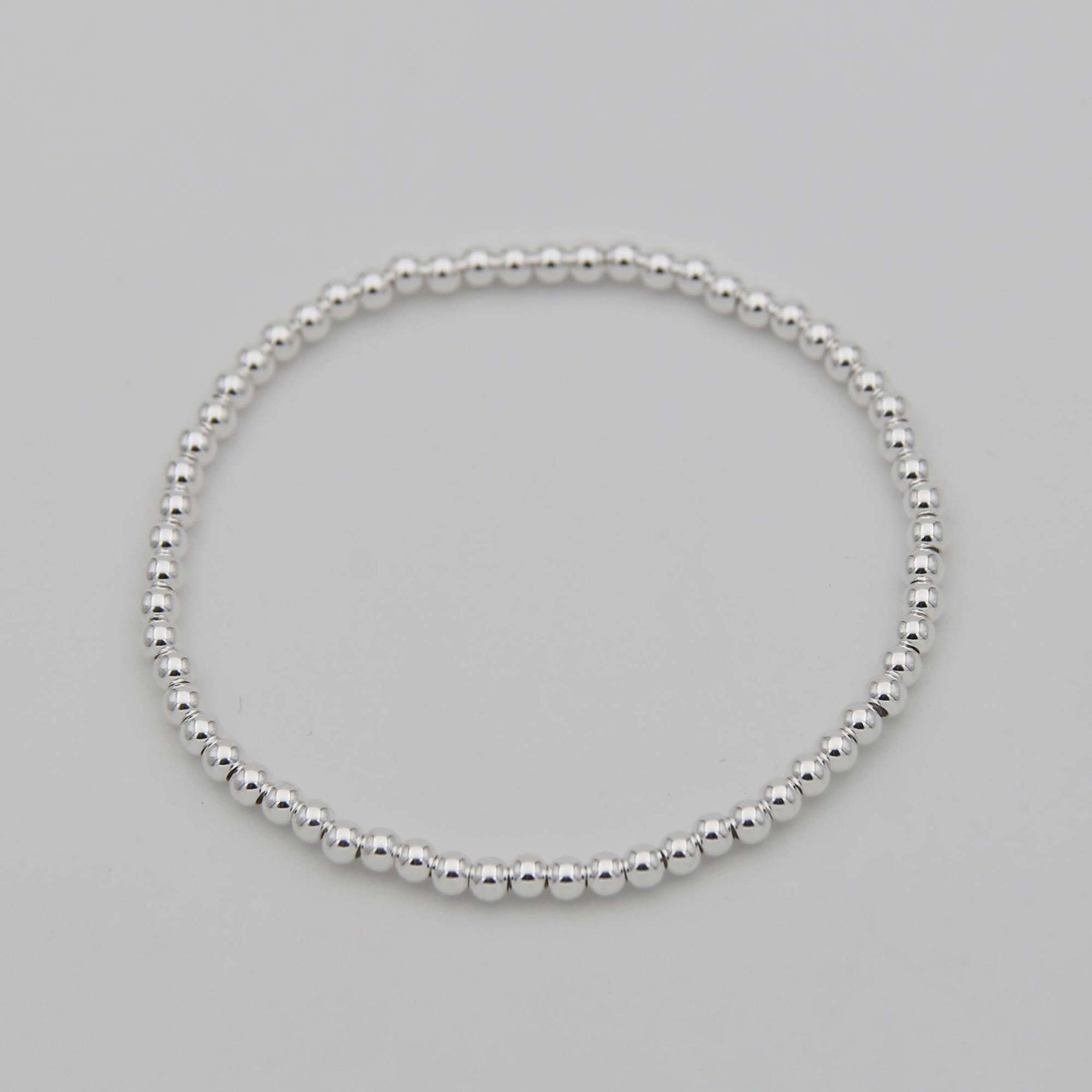 Серебряный браслет из шариков 3мм на резинке 3P217