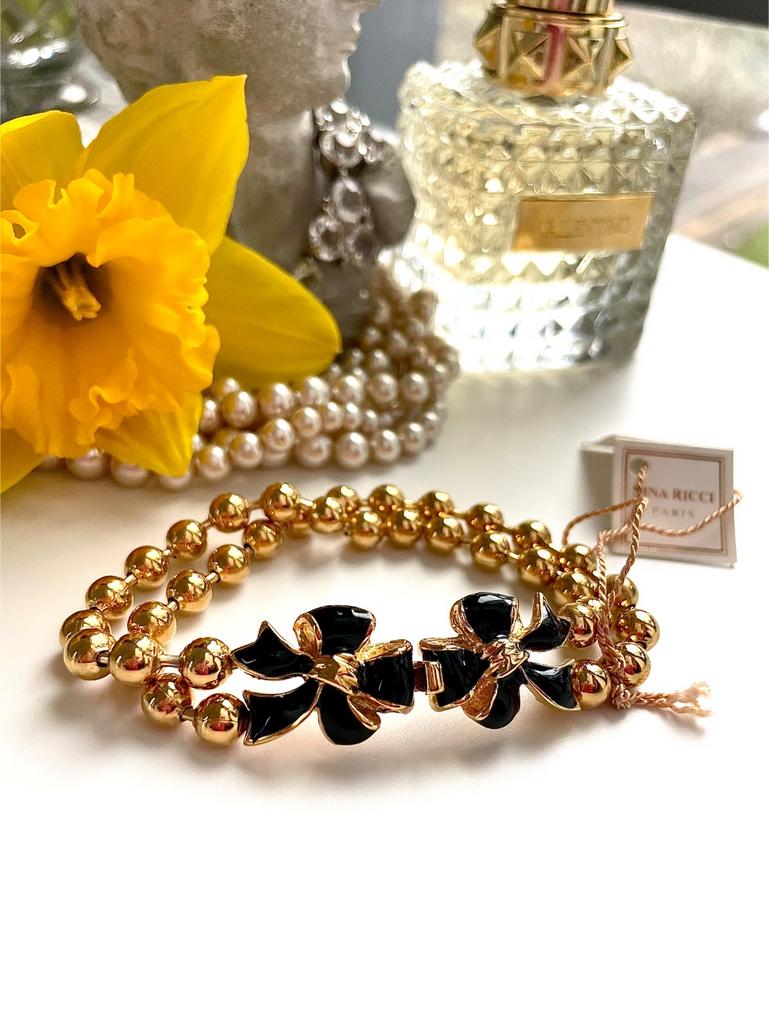 Браслет с черными бантиками