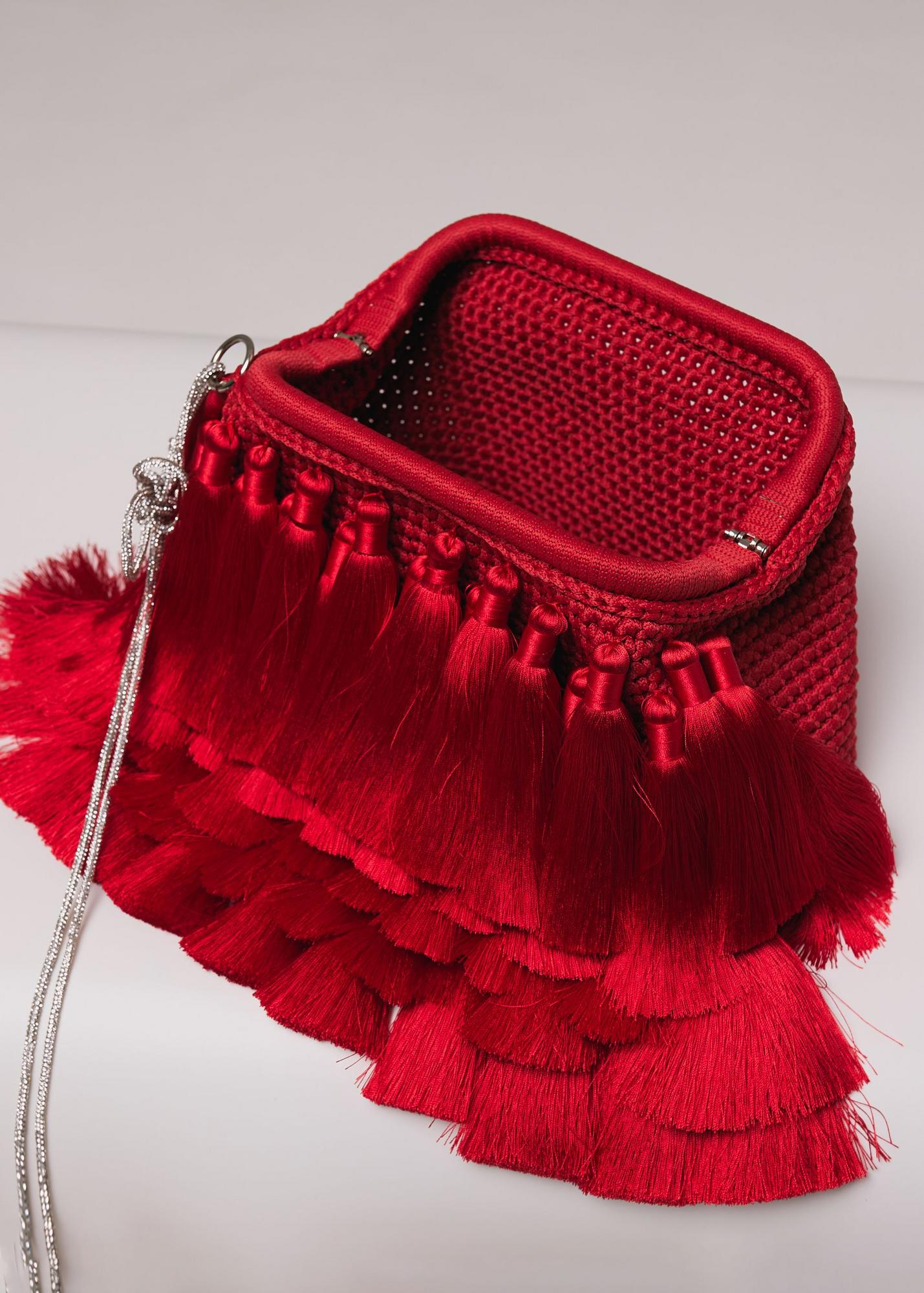 Knitted clutch with tassels, red