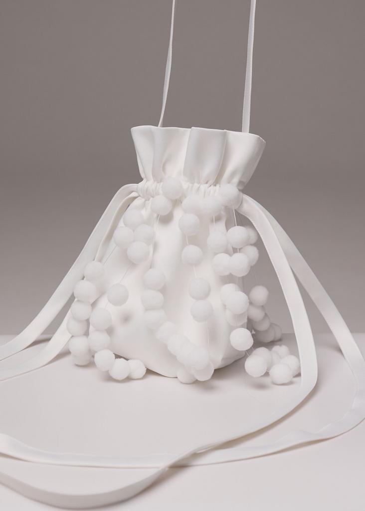 Bag-pouch with fur pompoms, milky