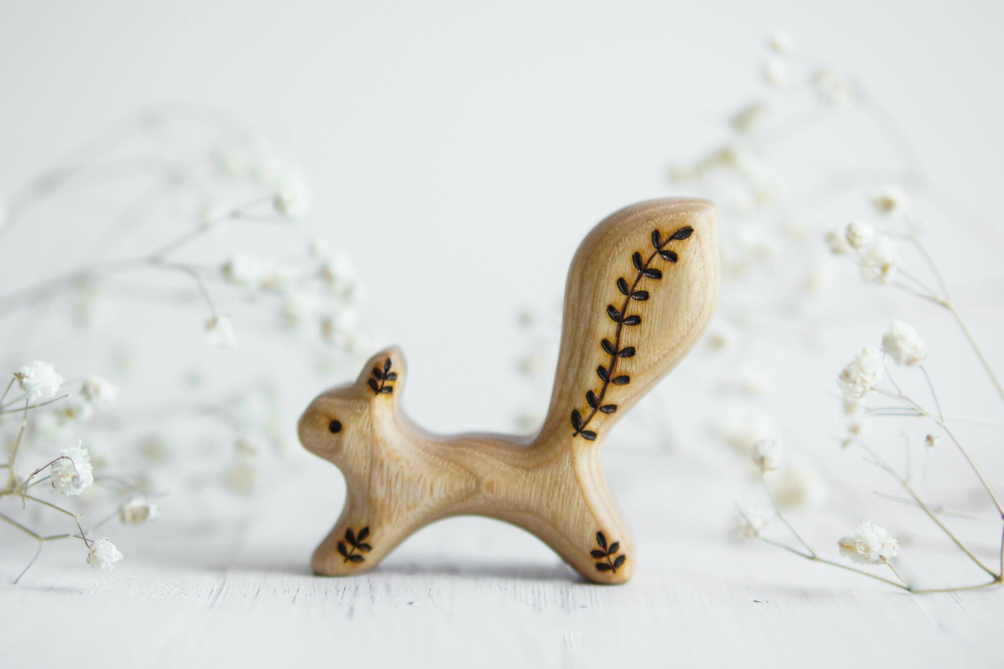 Little squirrel running twig