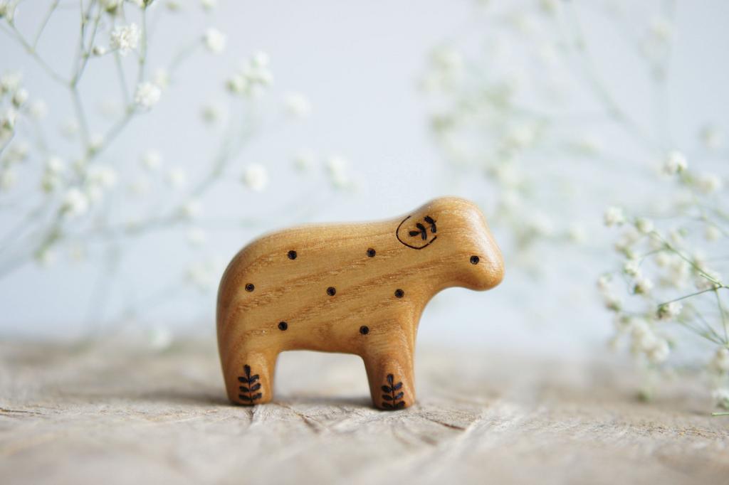 Lamb wooden toy (with a twig on the ear) natural