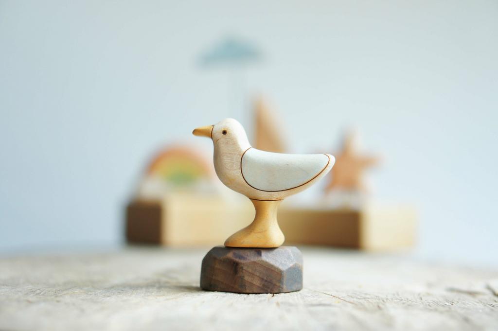 Seagull wooden figurine with stone (painted)
